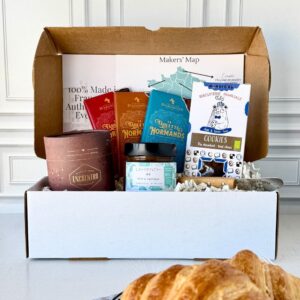 Open box of French chocolates from France with assorted artisanal treats and packaging