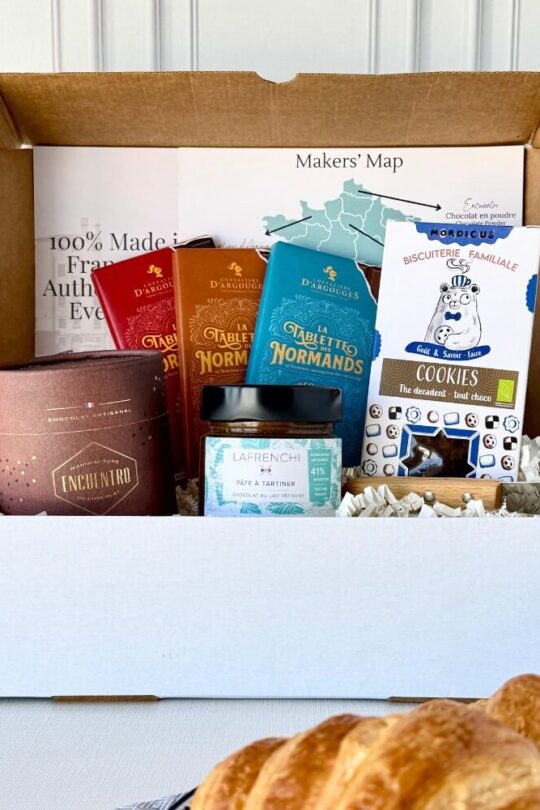 Open box of French chocolates from France with assorted artisanal treats and packaging
