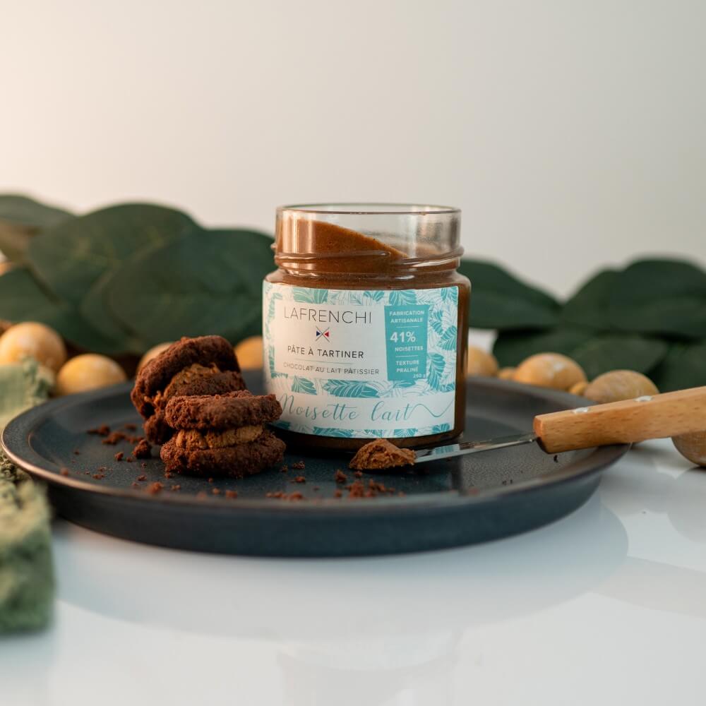 Jar and biscuits from French chocolates from France artisanal collection on a dark plate